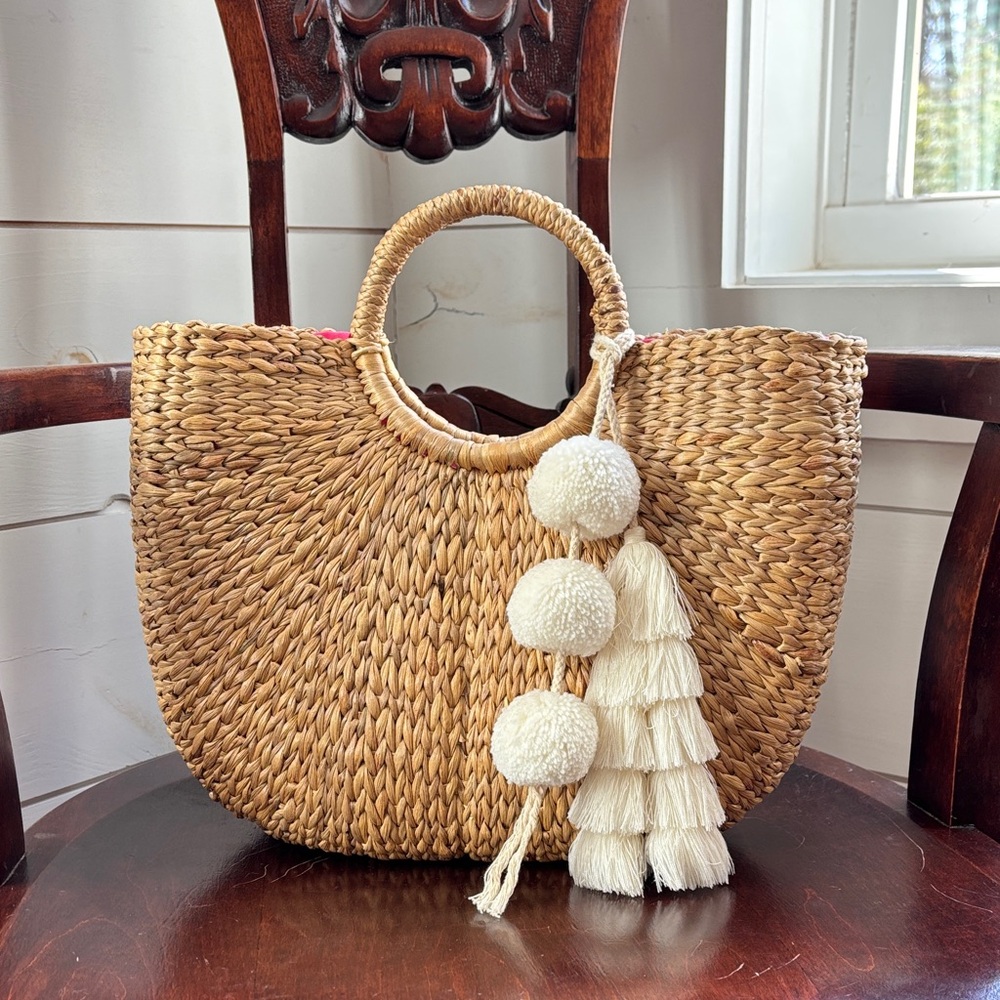 JADEtribe straw bag with white tassel